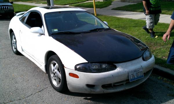 What it looked like the day I got it. Paint brushed with white house paint. Mismatched hood.
